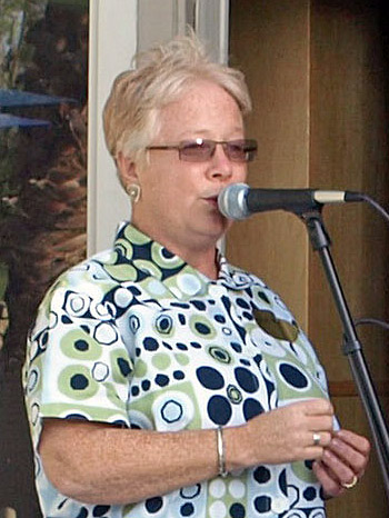 Debra singing at the party